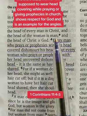 The image is a close-up of an open book containing a passage from the Bible. A pen is holding the book open at the highlighted scripture. The text is overlaid with red boxes that contain additional text. The composition is tightly framed on the text with a red box overlay.