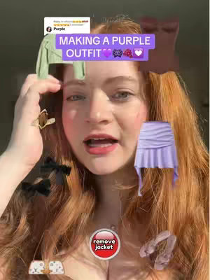 The image features a young woman with long reddish hair, looking directly at the camera with an open mouth. Overlaid on the image are various virtual outfit additions like a green jacket, a purple mini-skirt, various bow accessories and shoes, suggesting outfit choices. Text overlays like 'MAKING A PURPLE OUTFIT' are present at the top left.
