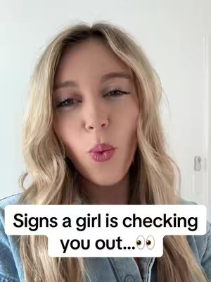 A woman with long blonde hair is centered in the frame, looking directly at the camera with a slightly pursed lip. A white box at the bottom contains the text overlay.