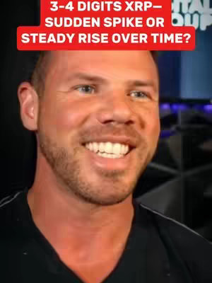 A close-up shot of a man with a smiling face. He has short, light brown hair and a closely trimmed beard. Above his head is a red rectangular banner with white text.
