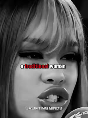 The cover image is a black and white close-up of a woman with bangs and dark eye makeup. She is speaking into a microphone. The text "a traditional woman" is overlaid in red.