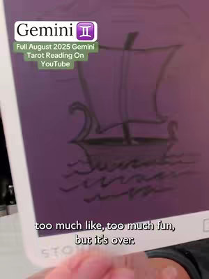 The image shows a close-up of a tarot card held by hand. The background is a gradient of purple and white. In the center of the card, there is a drawing of a boat. At the top left corner, there is a transparent panel with the description `Gemini` and a Gemini symbol. The rest of the panel has the description, `Full August 2025 Gemini Tarot Reading On YouTube`. The image also contains some text description on the lower part of the card.