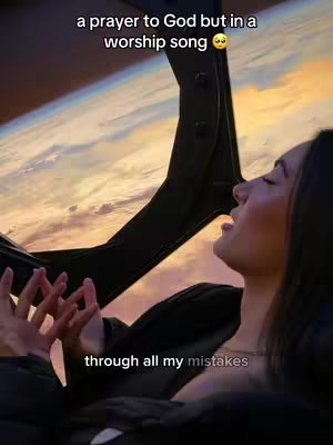 The cover image shows a woman with dark hair gazing upwards with an open mouth. The background features a beautiful sunset over a landscape, likely seen from an airplane window. Text overlays are placed on the image and the woman's face.