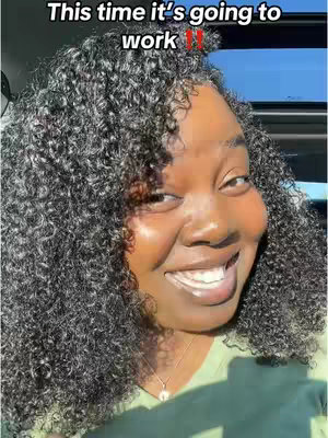 A selfie-style image of a woman smiling widely in a car. She has curly dark hair, and the background shows glimpses of a sunny sky. Text overlaid on the image reads, 'This time it's going to work !!'