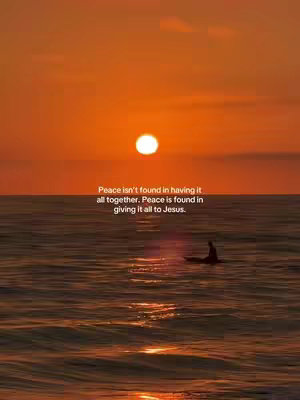 A sunset over the ocean with a silhouetted figure on a surfboard. Text overlaid expresses a message of peace through faith.