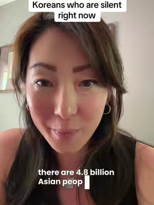 A frontal selfie of a woman. She has dark hair, fair skin, and is wearing a black top. Text overlays appear at the top and bottom with a message. She is looking directly into the camera.