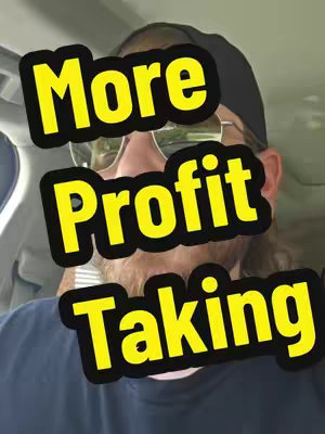 A selfie-style shot with a man in sunglasses and a black hat inside a vehicle. Bold yellow text over three lines reads "More Profit Taking" against a black background.