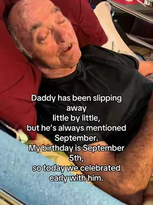 The cover image shows an elderly man lying in bed, partially obscured by a red pillow. He has his eyes closed and appears to be softly speaking. Text overlays are positioned at the top and bottom of the image, providing context about the situation, mentioning his birthday and a celebration.