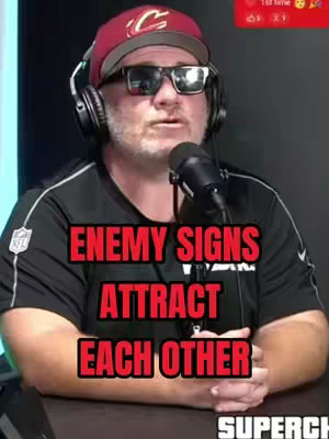 The cover image features a man in a maroon baseball cap and sunglasses addressing the camera, with text overlays. He is wearing a black shirt, with the words "ENEMY SIGNS ATTRACT EACH OTHER" in red, bold font, and the word "SUPERCHAT" at the bottom.