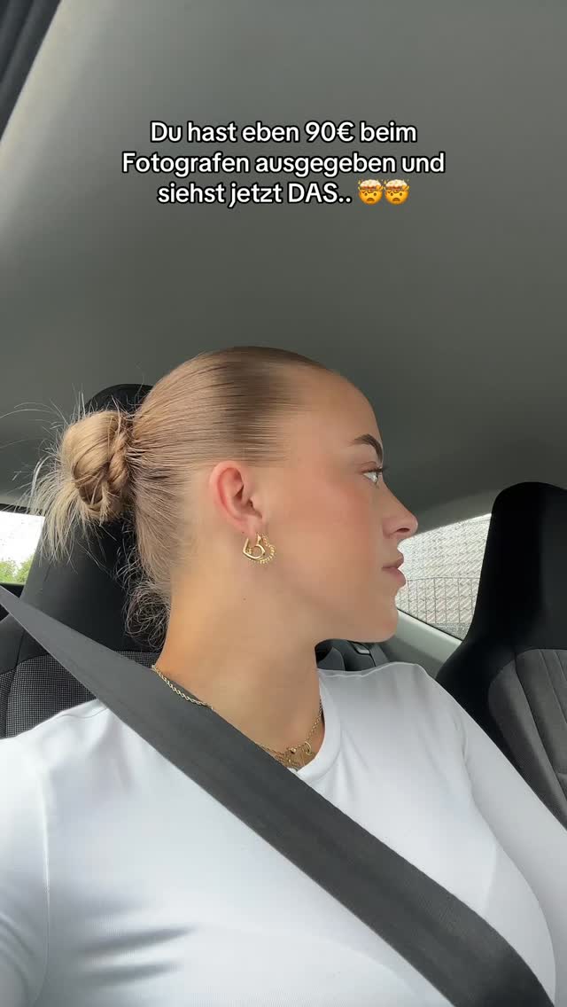 A woman is shown in the driver's seat of a car, looking back and to the side. She has blonde hair pulled back, wearing a white top and gold earrings. Text overlays are added to the cover image