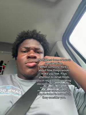 A selfie-style cover image features a young Black man, with curly hair and a slight pout, positioned in the driver's seat of a vehicle. He's wearing a gray short-sleeved shirt and a seatbelt is visible across his chest. Text is overlaid on the right side of the image, presenting a quote about the importance of considering another person's feelings in a relationship. The background includes the car's interior, with a headrest and hints of windows on the right side.