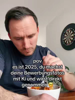 A man is shown from the chest up, holding a fork with food in a bowl while looking down with a thoughtful expression. Text overlayed on the image includes the abbreviation POV, and text in German speculating about using AI for job application photos in the future.