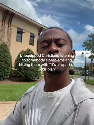 A selfie-style video cover image shows a young Black man from the chest up, set outside of a building. The man is staring at the camera with a concerned expression. Text is overlaid on top of the image. The background shows a building, some greenery, a street, and a partly cloudy sky.