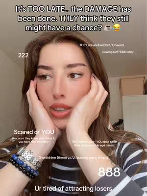 A selfie-style image featuring a woman with long brown hair. The image has text overlays with messages and numbers. The woman has her hands close to her face and seems to be looking away with a pensive or concerned expression. The background is lightly blurred, featuring hints of a room setting. The overall tone suggests a personal reflection with elements of tarot and numerology.