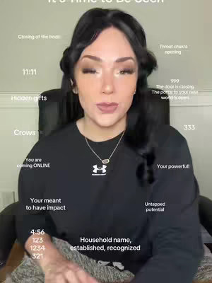 The cover image features a woman looking directly at the camera, with text overlays around her head. She has dark hair styled with two buns on top of her head, wearing a black Under Armour sweatshirt and a dainty necklace. The background appears to be a neutral-colored wall, with the woman seated in a black office chair.