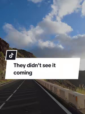 The cover image shows a scenic road curving through a mountainous landscape under a partly cloudy sky. A white text box carries the hook text, and the TikTok logo is present in the corner..