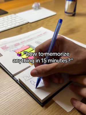 The cover image shows a wooden desk with a person's hands holding a blue pen over an open notepad. The notepad has some writing on it, as well as colorful sticky notes to the side. In the background there is a white keyboard and an angled glass with some blue accents. Overlaid on the image is a text hook. 
