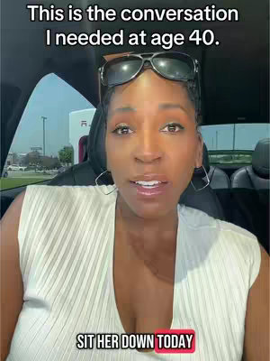 A woman with dark hair and sunglasses perched on her head sits in a car, facing the camera. Overlay text at the top says, "This is the conversation I needed at age 40." The woman's face is the focal point of the image, with her eyes looking into the camera and a slight smile. The bottom overlay says, "SIT HER DOWN TODAY".