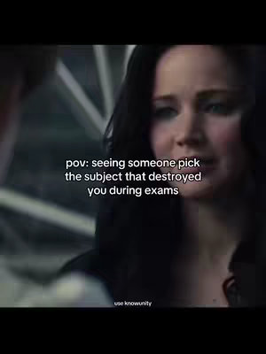 The cover image is a screen capture from a movie showing a close-up of a woman, Jennifer Lawrence likely, with a sorrowful expression. Above, a text overlay reads: 'pov: seeing someone pick the subject that destroyed you during exams'. The text color is white. The background appears to be a gray setting.