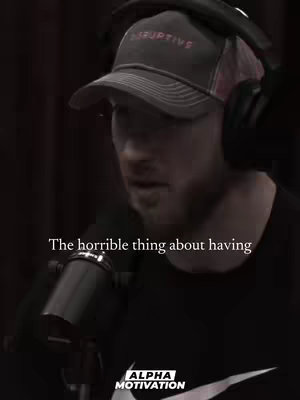 A man wearing a cap and headphones speaks into a microphone. Text overlayed on the image reads, 'The horrible thing about having...' against a dark background.