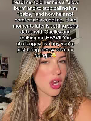A selfie-style shot featuring a young woman. She has long, wavy, highlighted hair and is wearing a white top. The background is slightly blurred with visible decor, suggesting a room. A text overlay lists drama-related context.