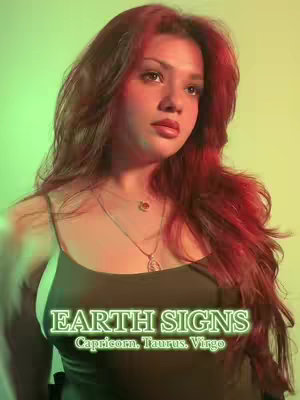 A young woman with long, reddish-brown hair is centered in the frame, with a green and yellow gradient background. She wears a dark green spaghetti-strap top and a delicate necklace. Text overlayed in a glowing neon green font reads "EARTH SIGNS" above "Capricorn, Taurus, Virgo".
