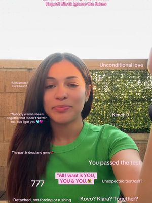 A selfie-style image with a young woman at the center, set against an outdoor background. She is wearing a green top. Several overlaid text boxes with questions and statements are scattered around her, suggesting a tarot or relationship-focused theme. The overall composition is casual, with the woman looking directly at the camera.
