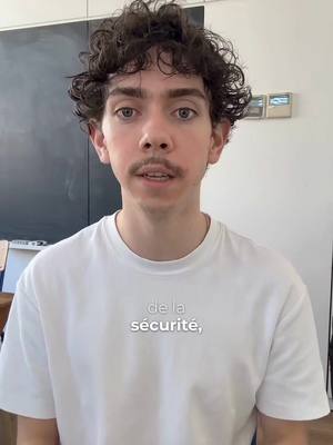 A young man with curly brown hair and a mustache is centered in the frame. He wears a white t-shirt in front of a blurred light background. Overlayed on the image is a text hook.