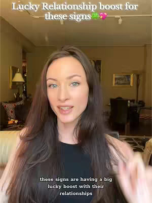 A woman with long brown hair is centered in the image, looking towards the viewer and speaking. Text overlays at the top and bottom provide context: 'Lucky Relationship boost for these signs' and 'these signs are having a big lucky boost with their relationships'. The background appears to be an interior space with a lamp and artwork.