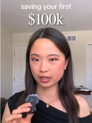 The cover image features a young woman holding a microphone, looking directly at the camera, against a neutral background. Overlayed text states, 'saving your first $100k'.