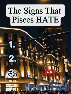 The cover image features a night-time cityscape with illuminated buildings and a dark sky. The primary focus is on a series of buildings with bright lights, and the text overlay is in a white rectangular box at the top of the image. Numbered labels like '1.', '2.', and '3.' are placed in the foreground, along with text that says 'The Signs That Pisces HATE'.