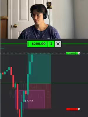 A man in a dark blue patterned shirt and headphones sits in front of a white door, the upper part of a trading interface appears on the lower section of the image.
