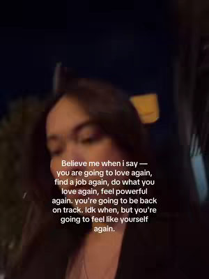 A blurry, slightly dark selfie-style image. A person with dark hair is prominent in the foreground, positioned slightly off-center. The background is mostly dark with some hints of light, and the image has a vertical orientation. Overlaid text in white at the bottom contains uplifting messages.