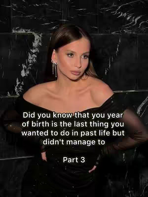 A woman with long brown hair and a black dress gazes toward the viewer, set against a textured black wall. Text overlays with white font.