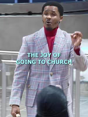 A man in a blazer is standing in front of a metal rail. Text overlayed on the image reads: "THE JOY OF GOING TO CHURCH."