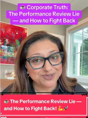 A woman with glasses is centered in the frame, smiling, and looking directly at the camera. Above her, text overlays read, 'Corporate Truth: The Performance Review Lie — and How to Fight Back' on a purple background, and at the bottom, a similar banner in red conveys the same message with a coffee cup, the text 'The Performance Review Lie — and How to Fight Back!', and a rocket ship emoji. The background includes a blurred painting and a window.