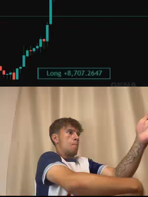 The cover image shows a young man reacting to a screen displaying a stock chart. The chart shows a line graph with green and red candlesticks, and the text overlay says "Long +8,707.2647." The background is partially obscured but appears to be a light-colored wall or curtain. The man is looking up and slightly to the left with a look of surprise or excitement, and he is gesturing with his right hand.