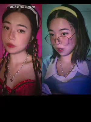 The cover image is a split screen featuring a young woman in two different settings. On the left, she is styled dramatically with a red top, a heart-shaped pendant, and side braids. The background is a bright pink. On the right, she wears a blue top and glasses within a more subdued setting.