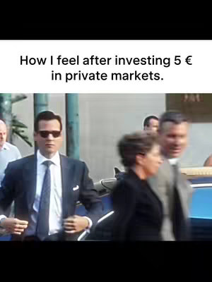 The image shows a man in a suit and sunglasses looking forward as he walks on the street. There are other people in the background.