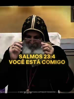 The cover image features a man in a religious garb, wearing a black hood and glasses. Text overlayed on the image features a bible verse. The background is softly lit. This image has a serious and religious tone.