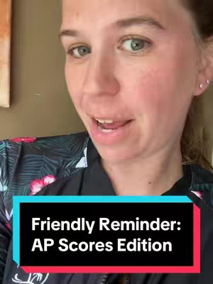A woman in a black top with a colorful floral pattern, looking towards the camera and speaking. The text overlay, in a black rectangle with a turquoise outline, reads, 'Friendly Reminder: AP Scores Edition'.