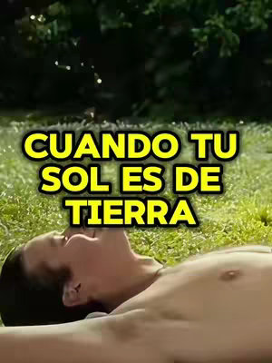 A person lying in green grass, looking upward at the sky. The person is shirtless. Overlaid on top is text in a yellow box.
