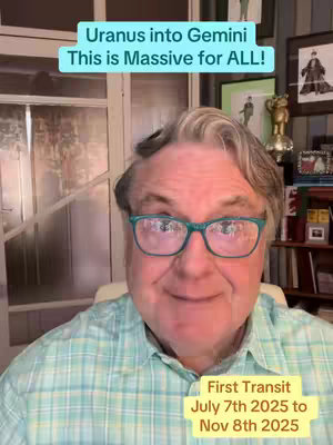 A close-up shot of a man with glasses is the focus. The man is smiling and looking at the camera. Above him is a light blue bar with the words 'Uranus into Gemini, this is massive for all!' Below, a gold bar says 'First Transit, July 7th 2025 to Nov 8th 2025'. The background is comprised of interior features like windows and wall decor.