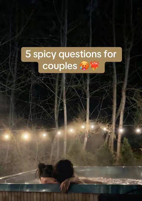 Two people are in a hot tub at night. Text overlay reads: "5 spicy questions for couples" with emojis. Trees and string lights are in the background.