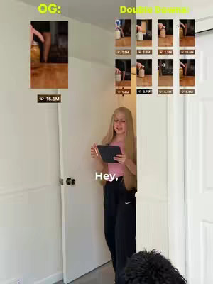 The image shows a young woman standing in a doorway, holding a tablet. The doorway is flanked by white walls, and in the background, there is a split-screen including video screenshots with view counts. Text overlays at the bottom of some thumbnails include view numbers with the 'M' representing millions. The woman is wearing a pink top and black pants and is talking.