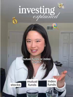 A woman is centered in the frame, smiling at the viewer, with text overlayed at the top that reads investing explained. Below the woman are three boxes with text 'stocks', 'mutual funds', and 'index funds', with a glass of water in front of each.