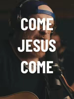 A man wearing a baseball cap and glasses singing into a microphone. Overlaid on top of him is the text 'COME JESUS COME' in large white letters.