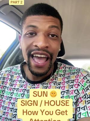A man with a beard and patterned shirt is in the front seat of a car, looking directly at the camera with his mouth open. Text overlays on the image include 'PART 2' at the top and a yellow rectangle with text about sun signs and attention at the bottom.