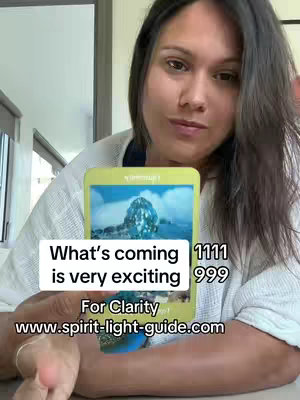 A woman is holding a tarot card with an illustration of a mountain in a blue background. Text overlays include predictions and a website address.