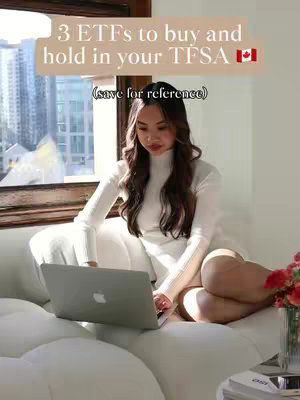 A woman is sitting on a white couch with a laptop in front of her. There is text overlayed on the image, and she is wearing a white turtleneck and looking at the laptop. The room has a modern design with large windows and a cityscape visible outside.